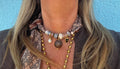 Sjaalketting® 
- Bruin zwart met bruine bal