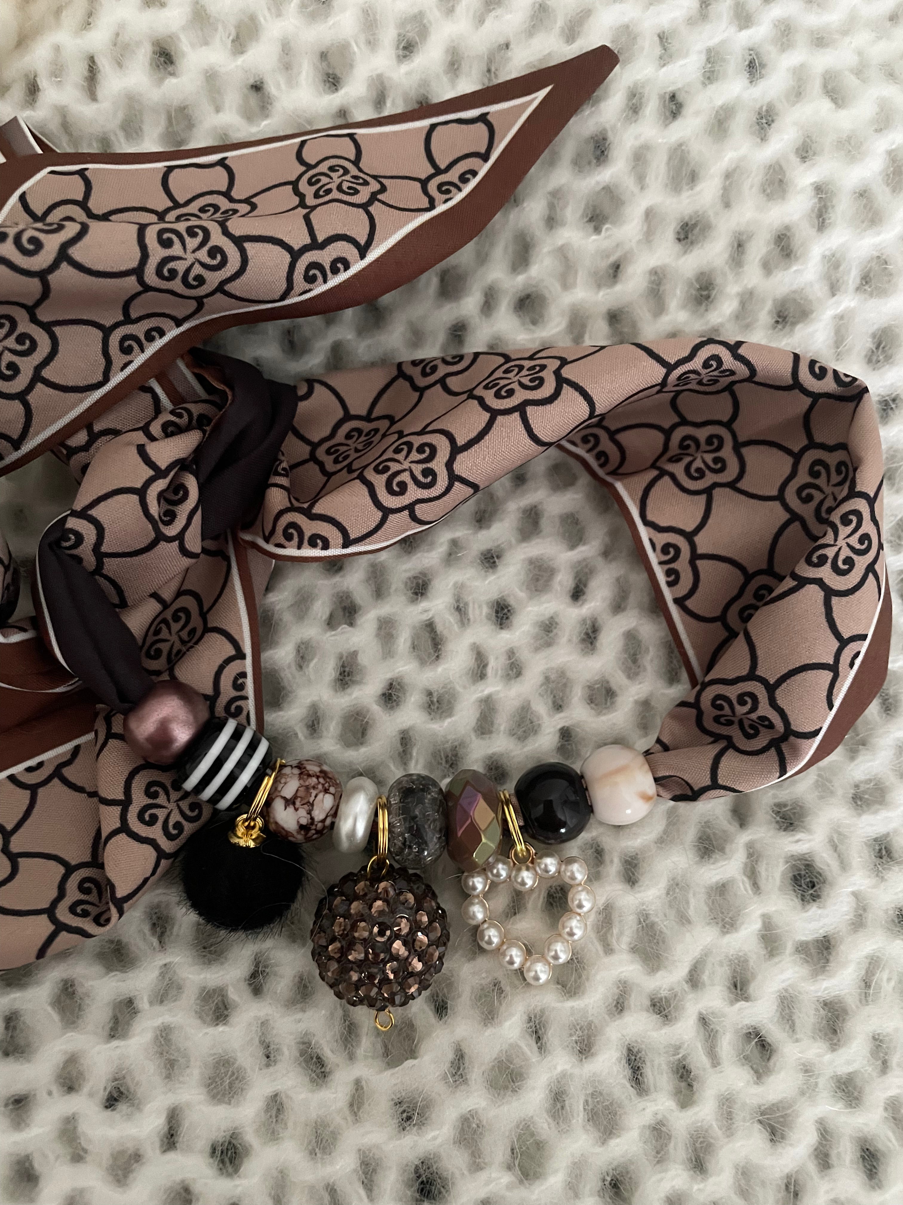 Sjaalketting® 
- Bruine bal