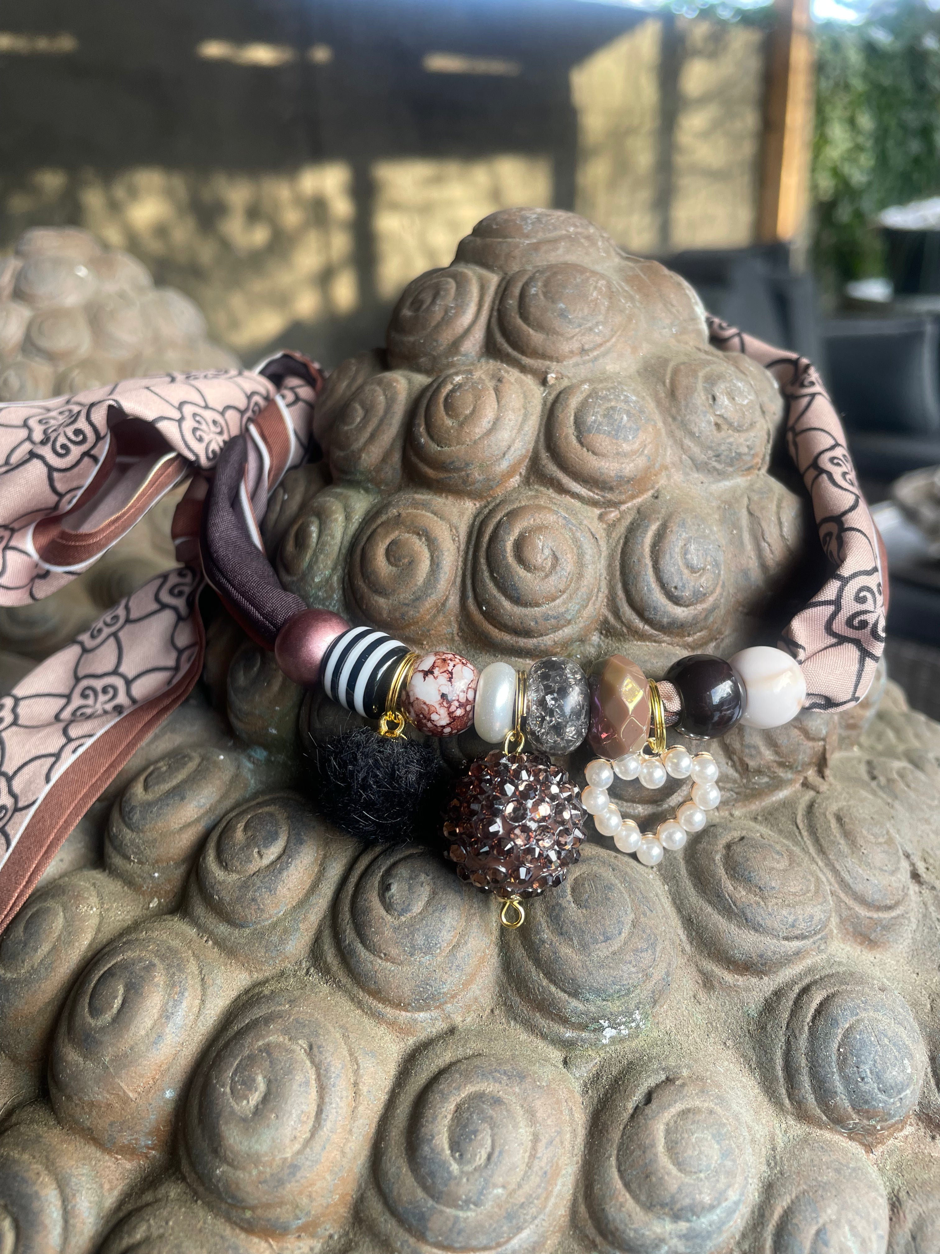 Sjaalketting® 
- Bruine bal